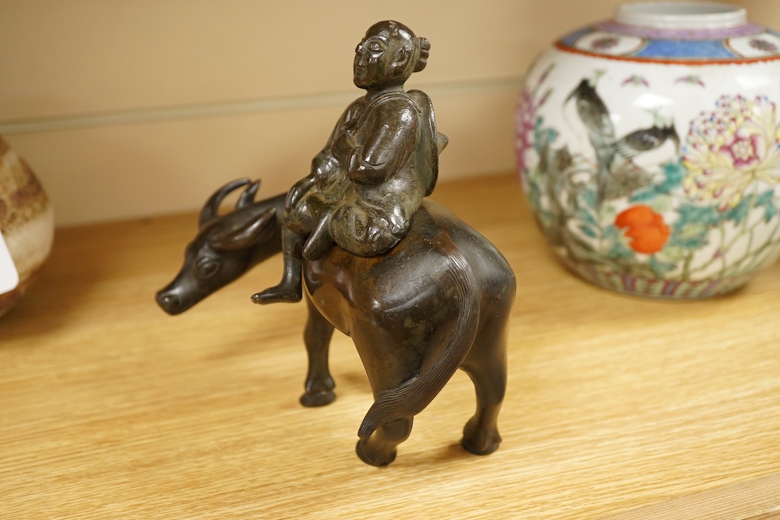 A Chinese bronze buffalo and figural incense burner, 18cm high